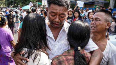 A former prisoner is embraced by his family following his release (Photo: Lucky)